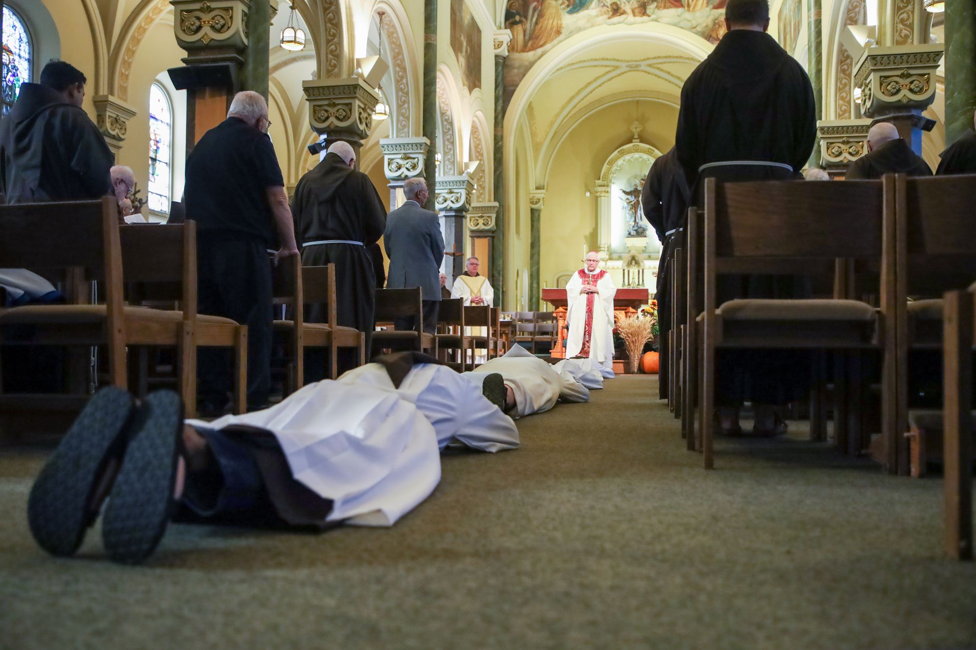 The ordinandi lie prostrate during the rite of ordination
