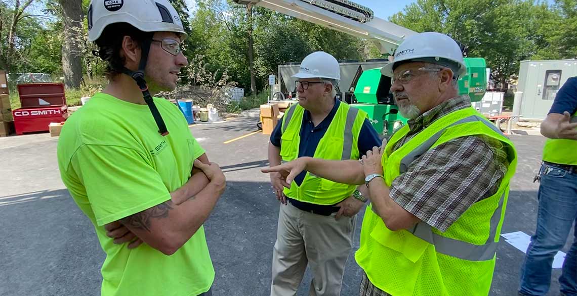 Clint Bindrich from C.D. Smith discusses construction with Br. Gary Wegner and Br. Kent Bauer.