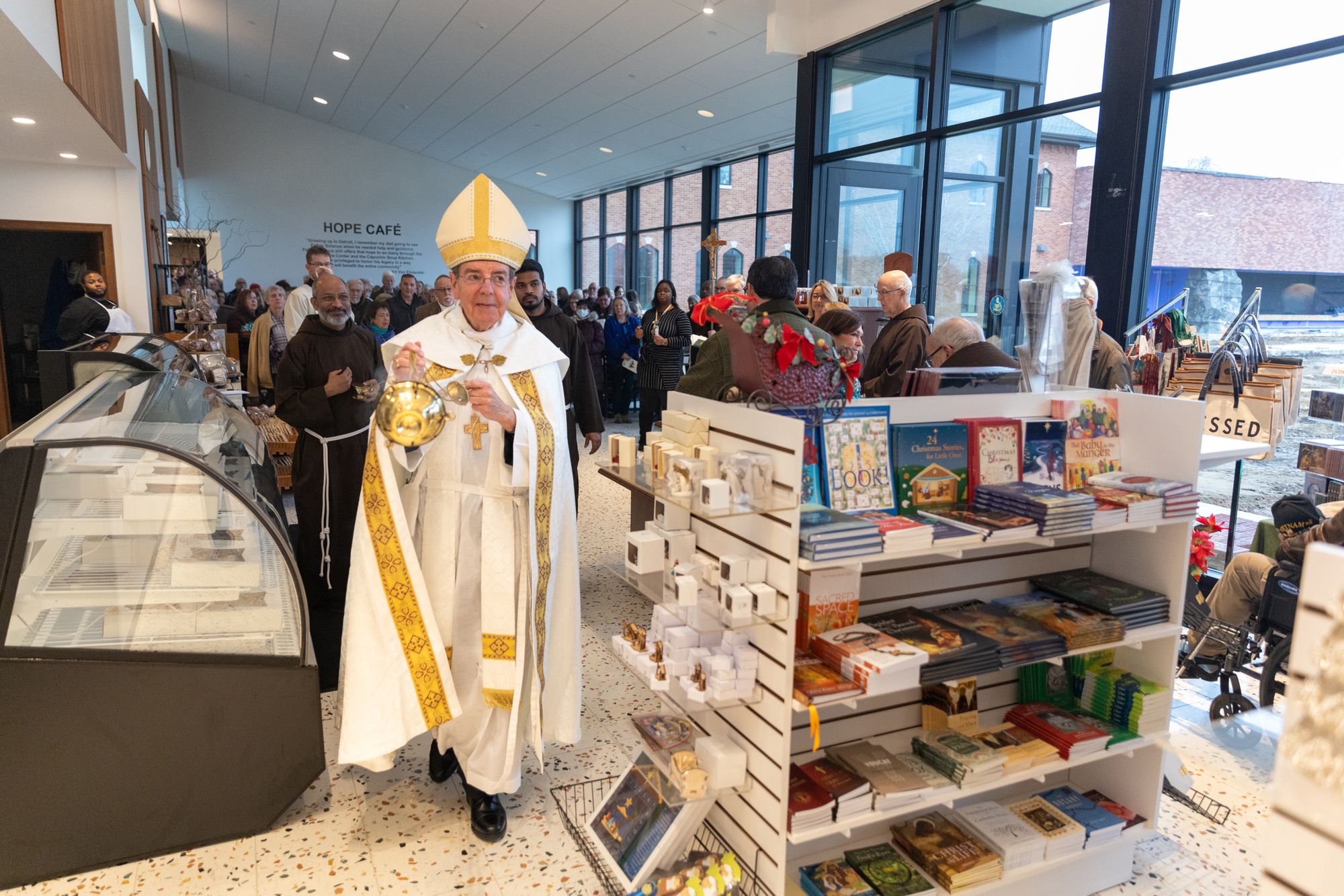 Archbishop blesses the new gift shop.