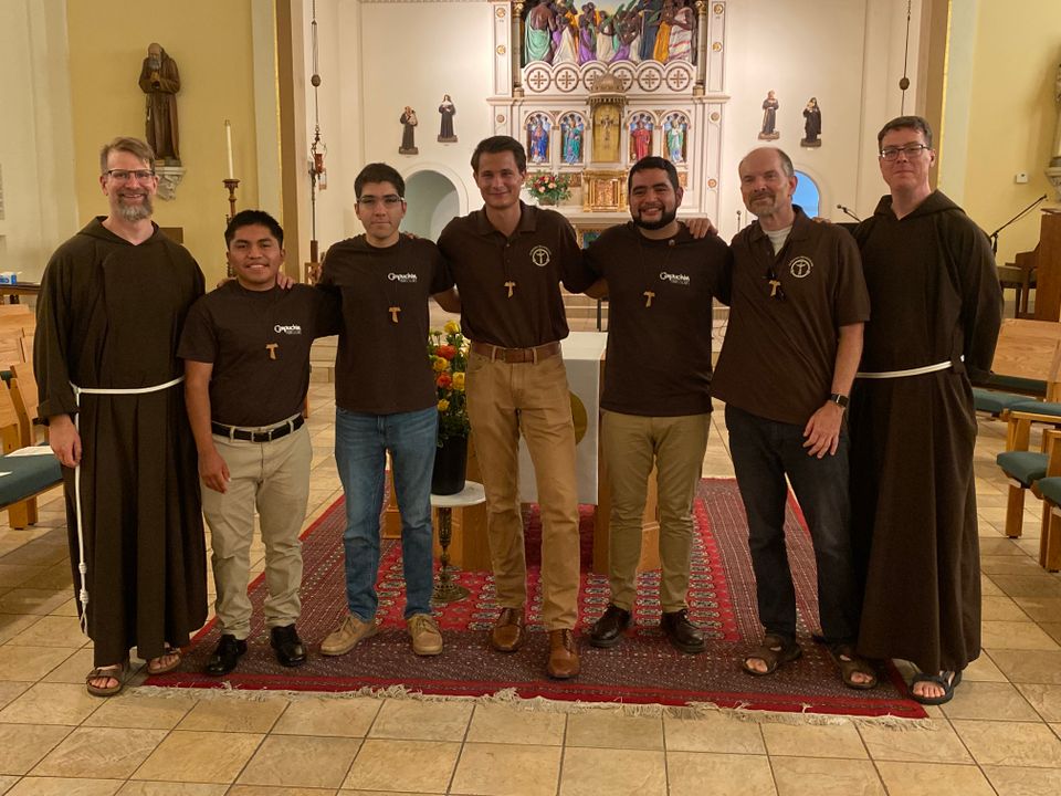 Br. Lake Herman and Br. David Hirt pose with this year’s postulant class.